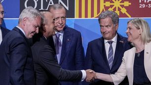 Turkish Foreign Minister Mevlut Cavusoglu, Sweden's Prime Minister Magdalena Andersson, Turkish President Recep Tayyip Erdogan, and Finland's President Sauli Niinisto after Turkey agreed to both countries’ accession to NATO in Madrid, June 28, 2022.