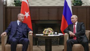 Russian President Vladimir Putin, right, and Turkish President Recep Tayyip Erdogan talk to each other during their meeting in the Bocharov Ruchei residence in the Black Sea resort of Sochi, Russia, on Sept. 29, 2021.