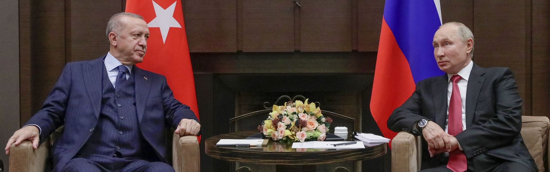 Russian President Vladimir Putin, right, and Turkish President Recep Tayyip Erdogan talk to each other during their meeting in the Bocharov Ruchei residence in the Black Sea resort of Sochi, Russia, on Sept. 29, 2021.