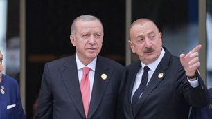 Turkish President Erdogan, Azerbaijani President Aliyev, and Pakistani Prime Minister Sharif pose for a photo at the end of the 17th ECO Summit in Khankendi, Azerbaijan, on July 4, 2025.