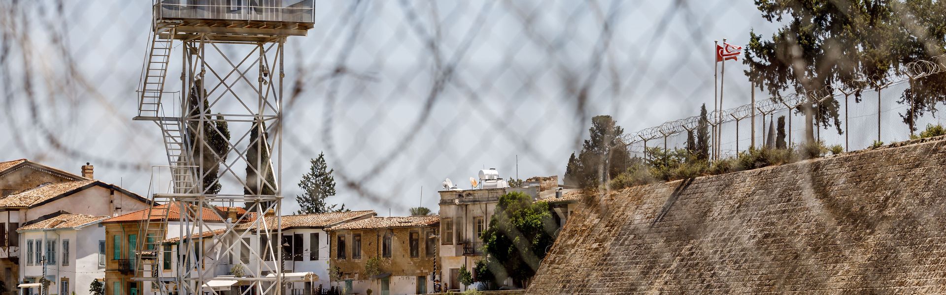 A UN outpost is being seen inside the buffer zone with the flags of Turkey and the self-declared ''Turkish Republic of Northern Cyprus'' visible on the right, in Nicosia, Cyprus, on July 20, 2024. A UN outpost is being seen inside the buffer zone with the flags of Turkey and the self-declared ''Turkish Republic of Northern Cyprus'' visible on the right, in Nicosia, Cyprus, on July 20, 2024.