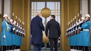 Ukrainian President Volodymyr Zelenskyy is escorted by Turkish Prime Minister Recep Tayyip Erdogan upon arriving for a bilateral meeting at the Presidential Palace in Ankara on February 18, 2025.