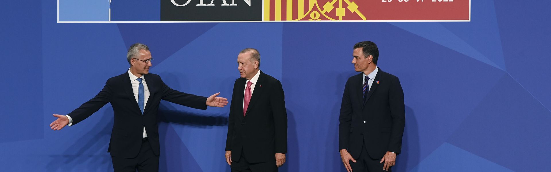 Turkish Prime Minister Recep Tayyip Erdoğan is greeted by NATO Secretary General Jens Stoltenberg and Prime Minister Pedro Sanchez of Spain, during the NATO summit in Madrid.