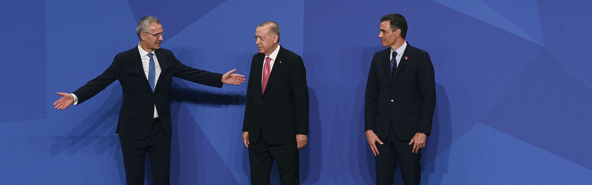 Turkish Prime Minister Recep Tayyip Erdoğan is greeted by NATO Secretary General Jens Stoltenberg and Prime Minister Pedro Sanchez of Spain, during the NATO summit in Madrid.