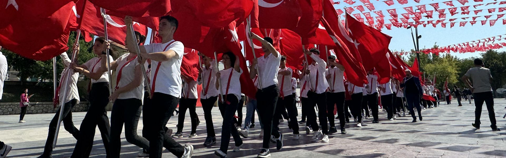 Students with Turkish flags take part in the celebrations of 102nd anniversary of Victory Day and Turkish Armed Forces Day at Istasyon Square in Gaziantep, August 30, 2024.