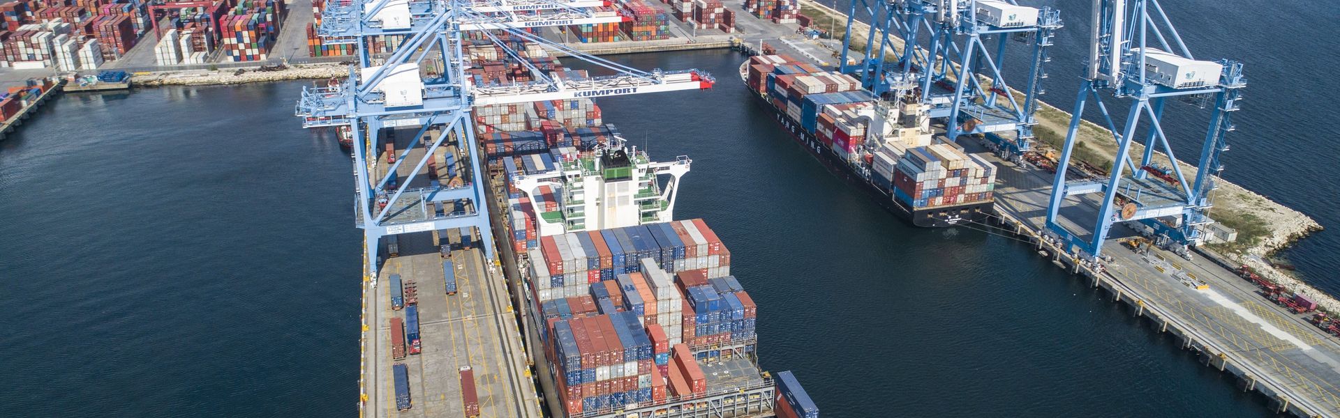 A port with a container ship from above