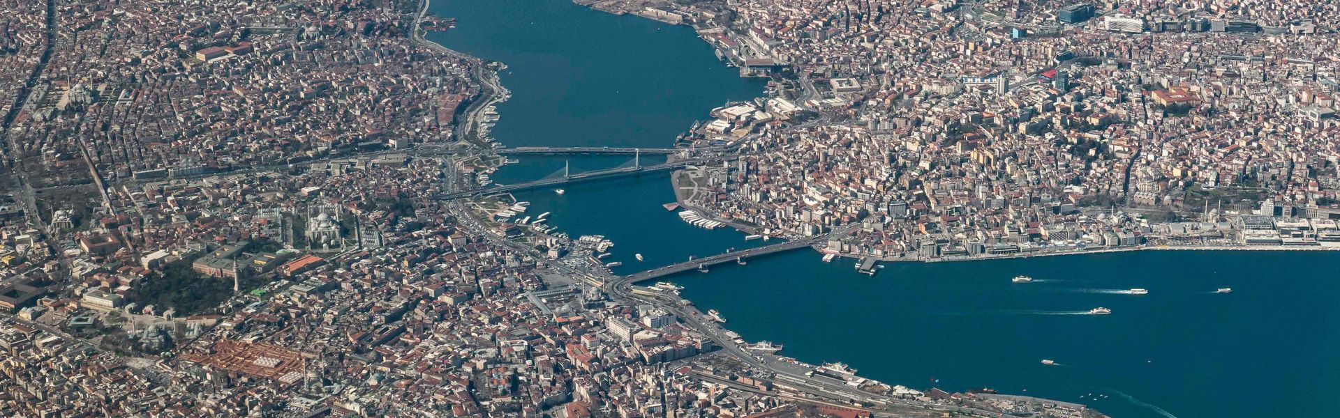 Aerial view of Istanbul, Turkey with World Heritage sites such as Hagia Sophia, Topkapi Palace, Blue Mosque, Galata Bridge and more in the Fatih district between the Golden Horn, the Sea of Marmara and the Bosporus.